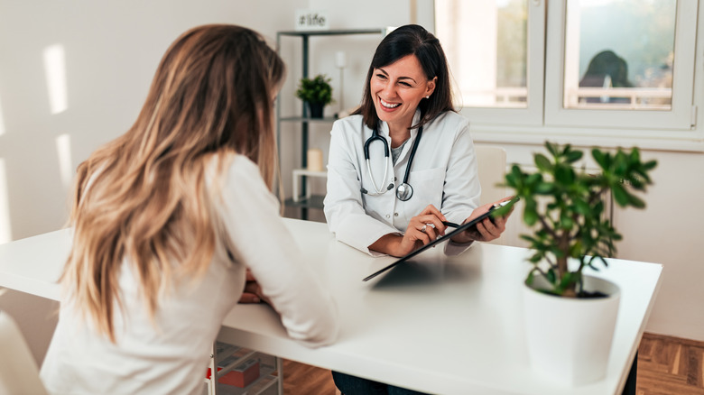 woman talking with doctor