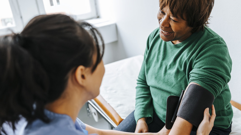 Older woman getting her blood pressure checked