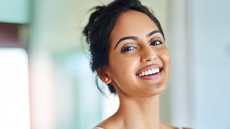woman with beautiful skin smiling