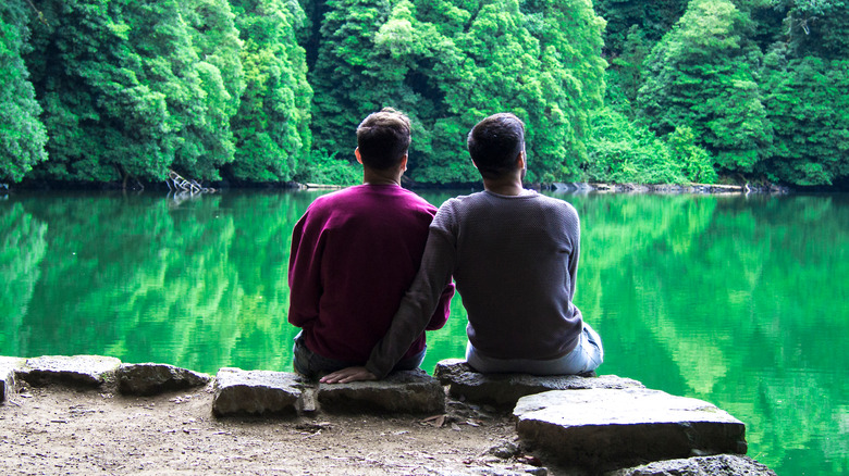 couple relaxing by a lake