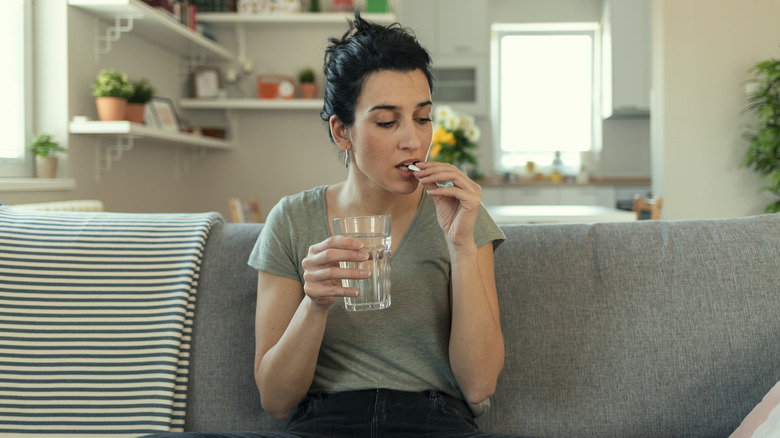 Woman taking medication