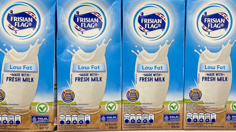 low fat milk cartons on a supermarket shelf