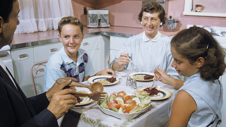 1960s family eating dinner in the kitchen