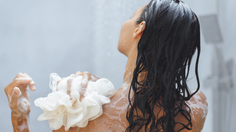 Woman using a loofah