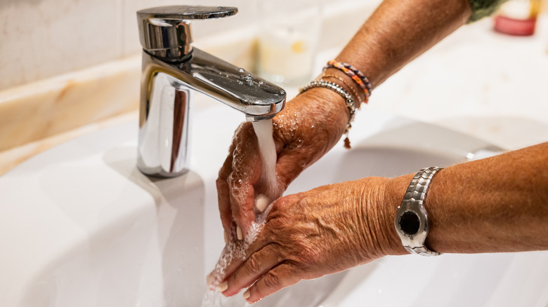 Woman washing her hands