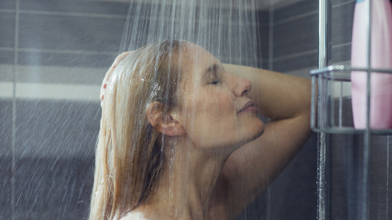 A young woman taking a shower