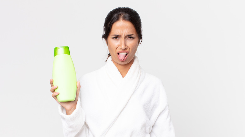 woman disgusted by a shampoo product