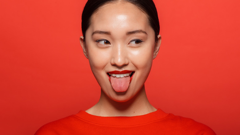 woman sticking out tongue