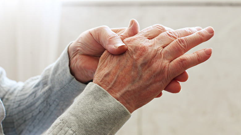 woman feeling achy hands