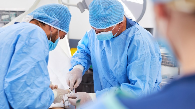 surgeons performing surgery