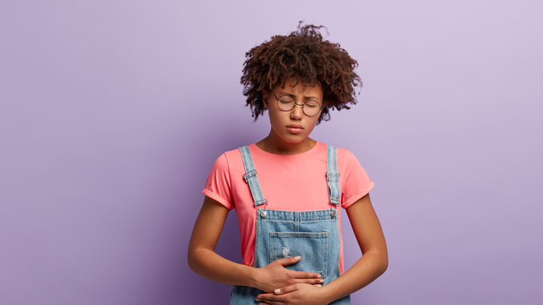woman with upset stomach
