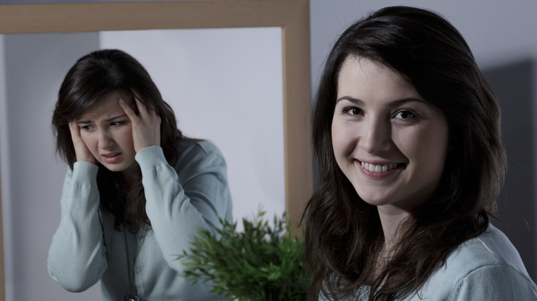 woman with reflection in mirror