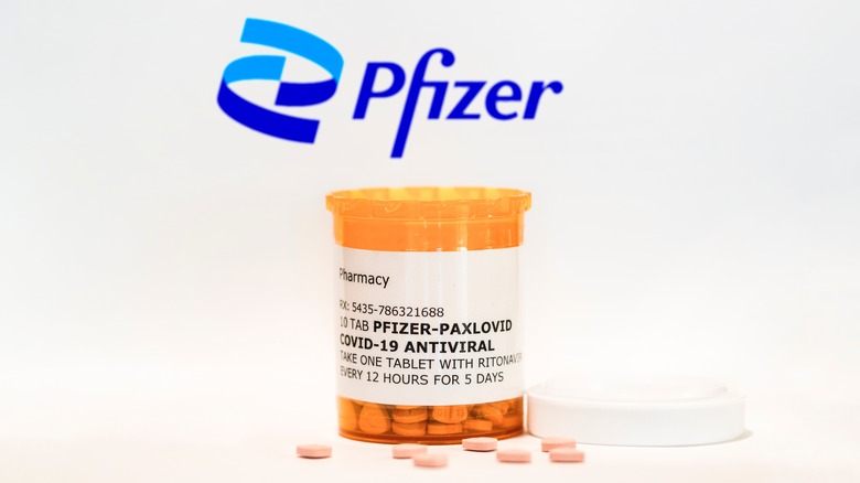 Prescription bottle of Pfizer's PAXLOVID on white background