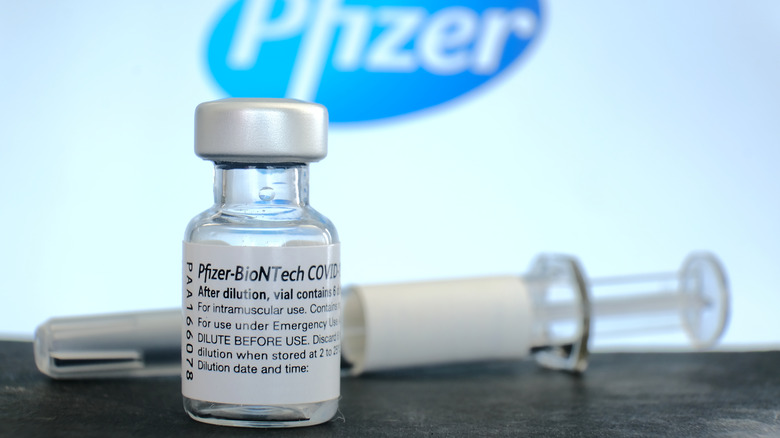 pfizer sign and vaccine vial