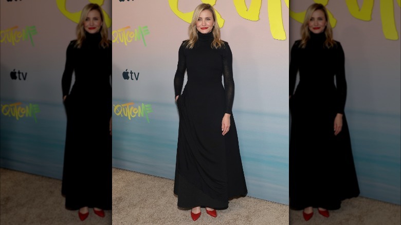 Cameron Diaz in long black dress and red shoes at event