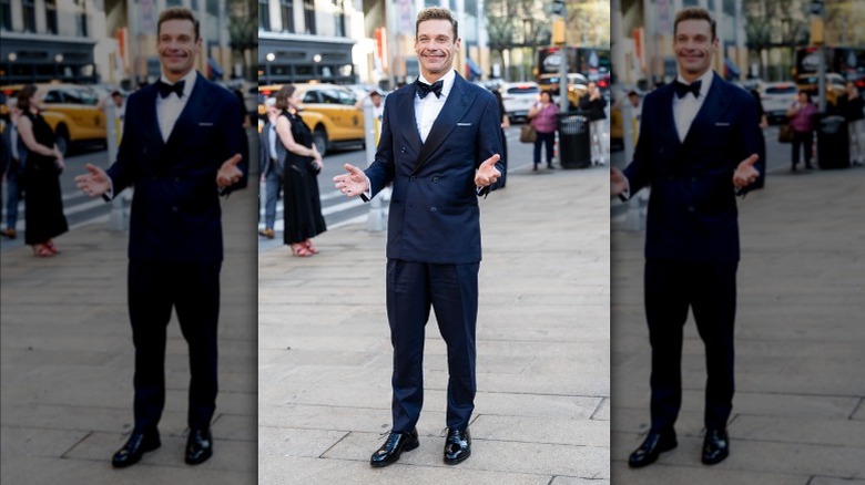 Ryan Seacrest on street in tux