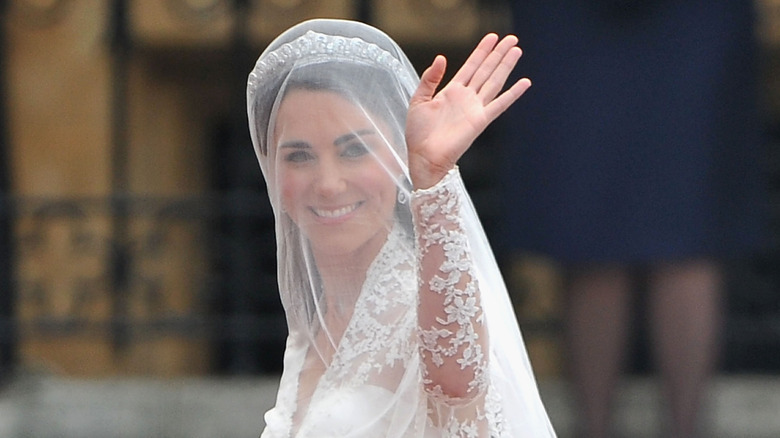 Catherine Middleton waving at the crowd before entering Westminster Abbey