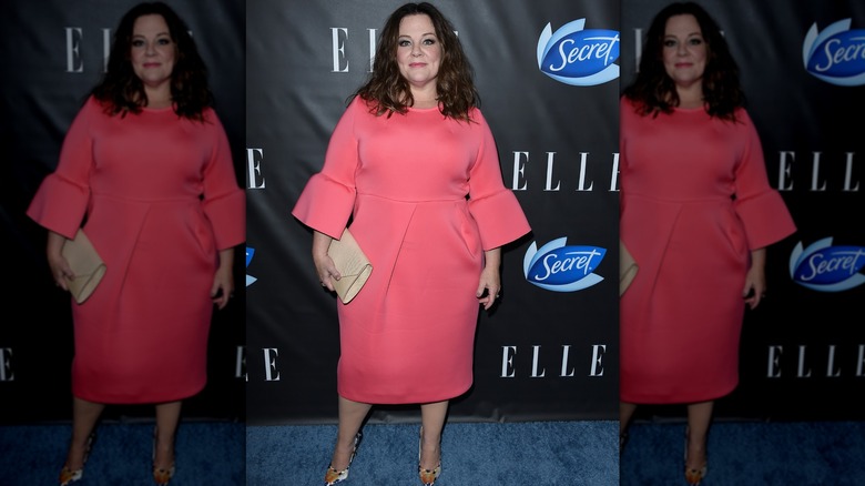 Melissa McCarthy smiling in a pink dress