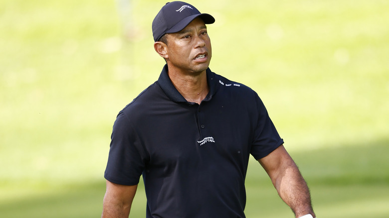 Tiger Woods playing during a tournament where he experienced back spasms