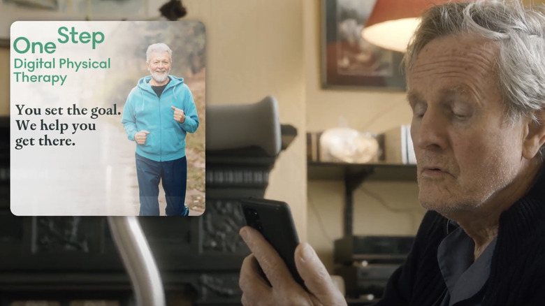 Older man looking at a phone with an overlay that says "OneStep Digital Physical Therapy: You set the goal, we help you get there"