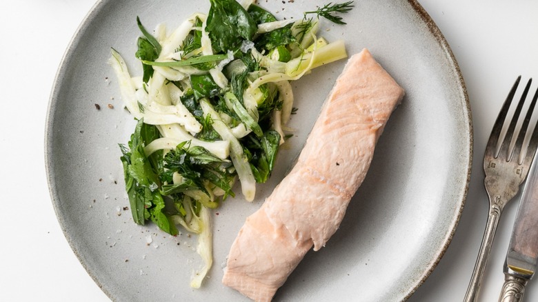 salmon with salad on plate