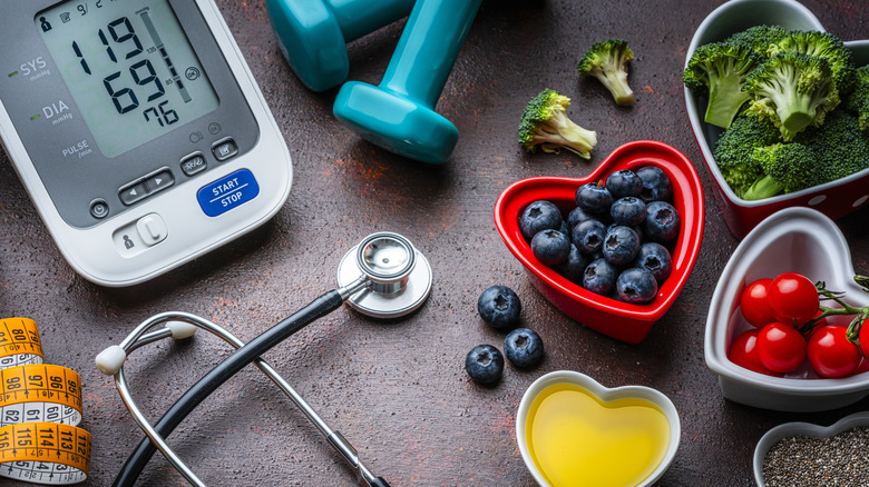 A photo of a blood pressure monitor with food