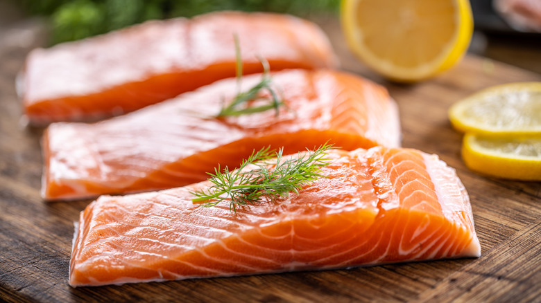 salmon filets on a wood block