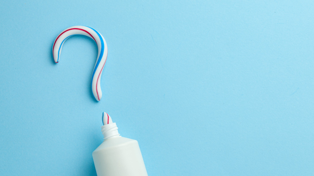 Toothpaste squeezed into a question mark shape