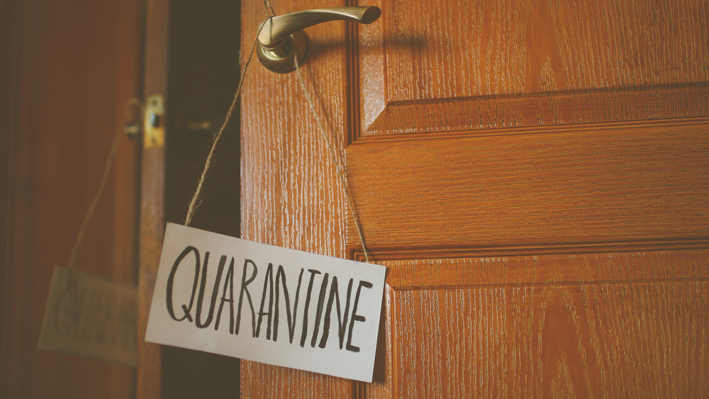 Quarantine sign on doorknob