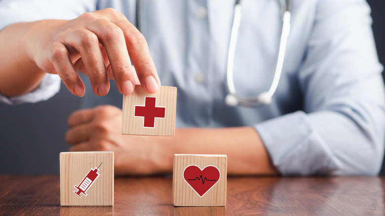 doctor stacking health blocks