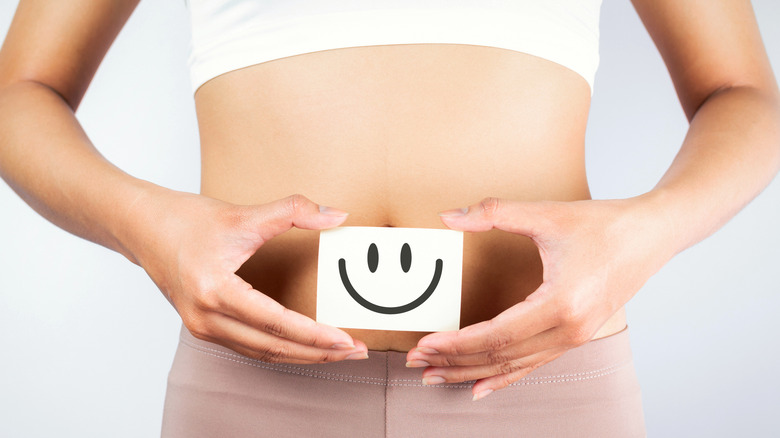 smiley face image over the stomach