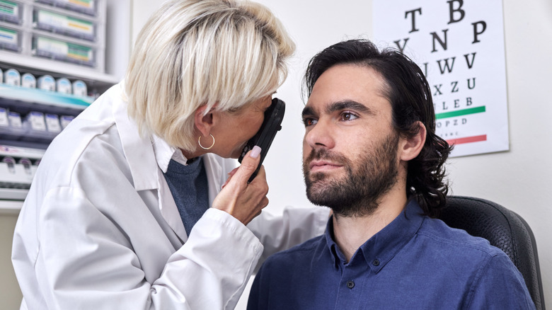 Eye doctor conducting an examination