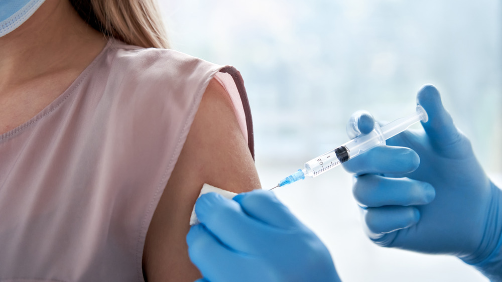 Woman receiving COVID-19 vaccine