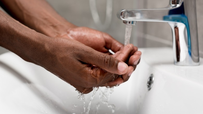 person washing hands