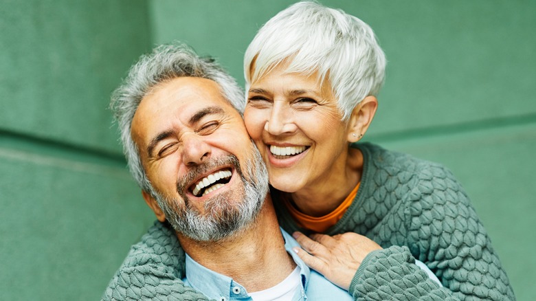 happy older couple embracing