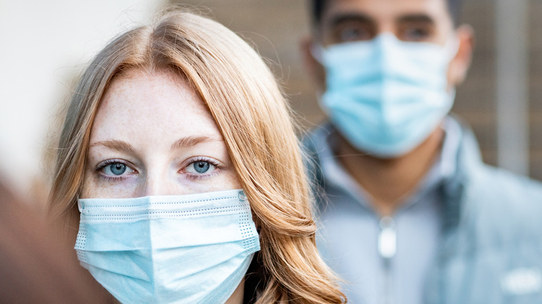 people outside wearing masks