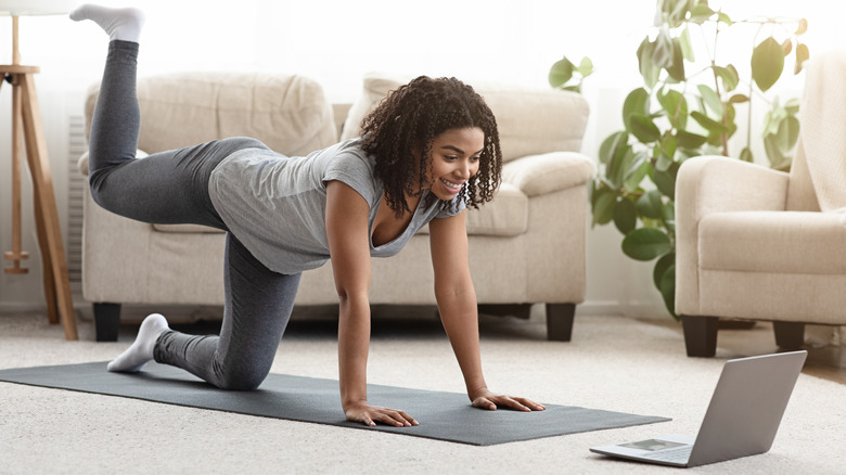 A woman working out at home