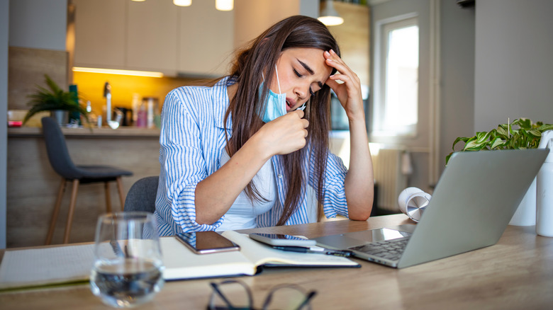 woman sick at work