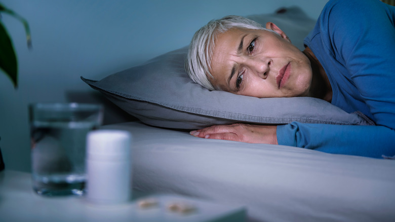 Woman staring at sleep medication