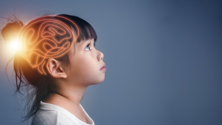 child with brain graphic superimposed 