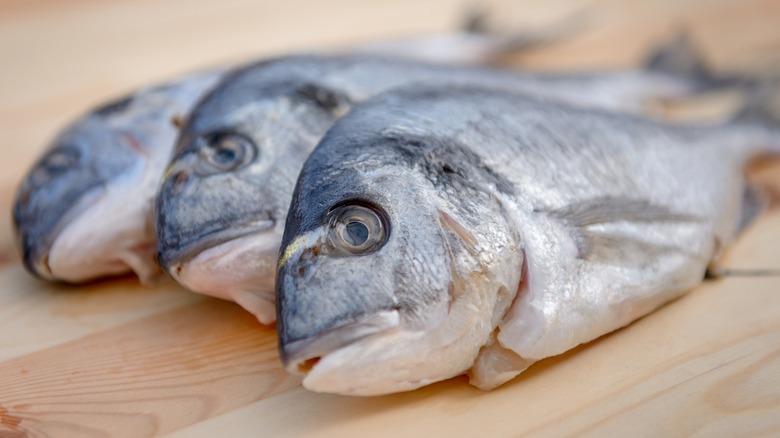 whole fish on wood table