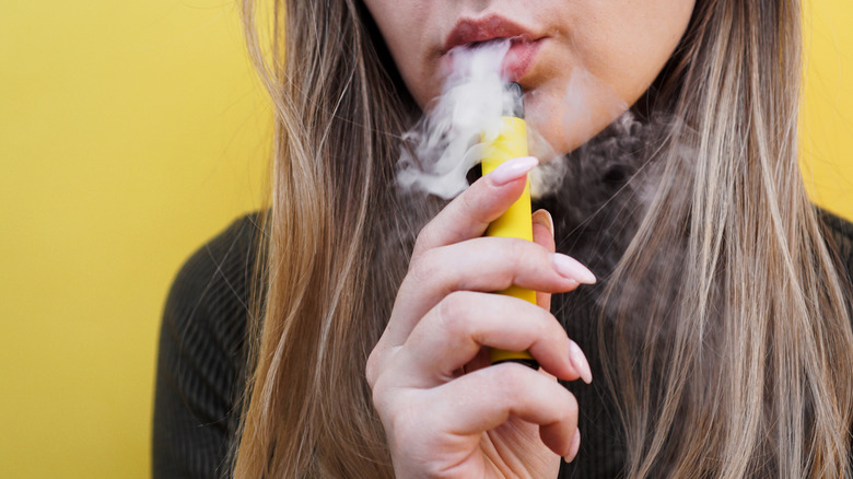 young woman vaping