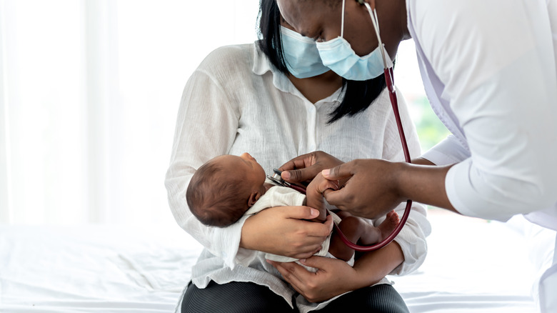 Mother, infant, and doctor 