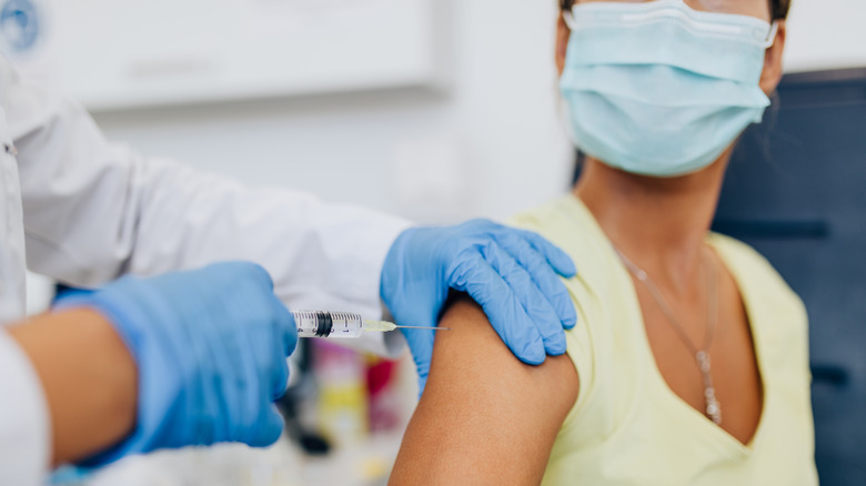 woman receiving vaccine