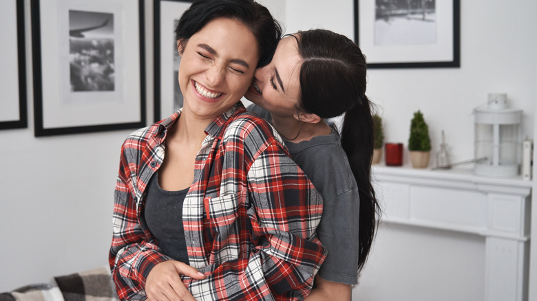 a lesbian couple laughing together