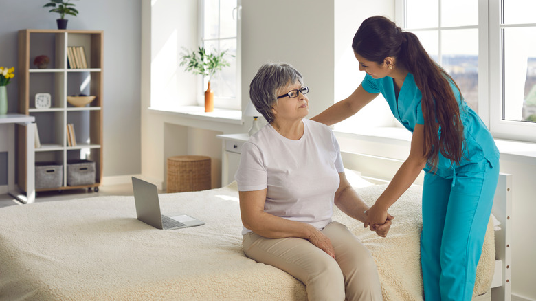 An older female patient and a nurse