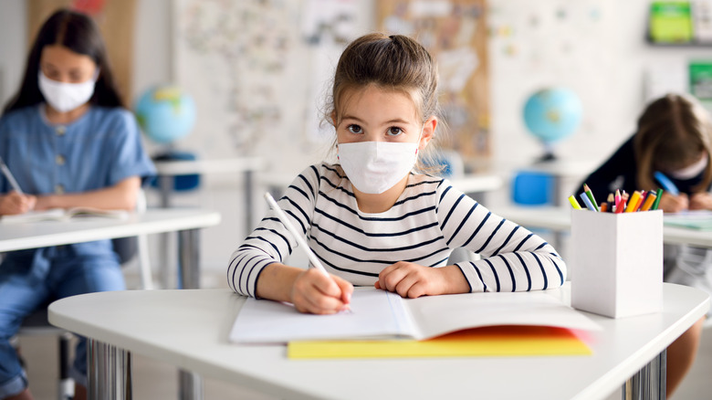 Children wearing masks at school