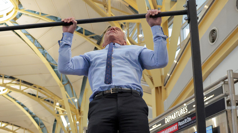 Robert F. Kennedy Jr. finishing a pull-up in an airport