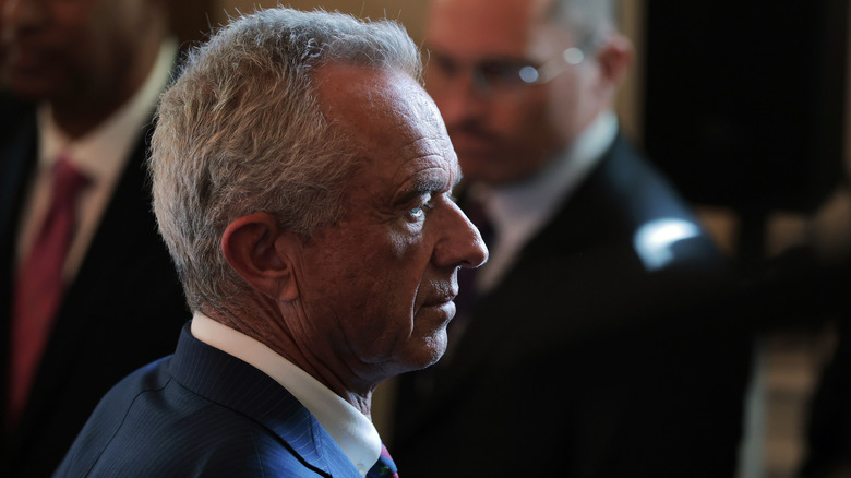 Side profile of RFK Jr. in contrasting shadows.