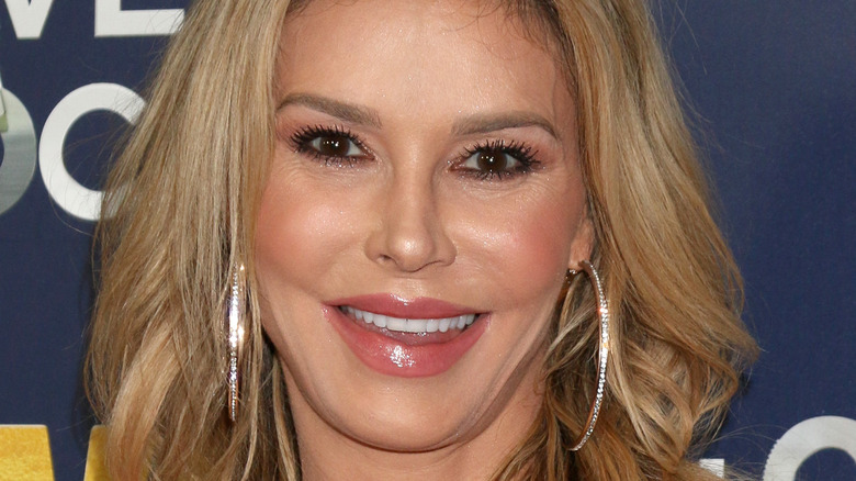 Brandi Glanville smiling, posing for photo